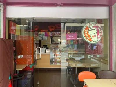 a window of a coffee shop with a sign on it at 81NB Cozy Studio -City View, 2 Queen Beds, NAIA T3 in Manila