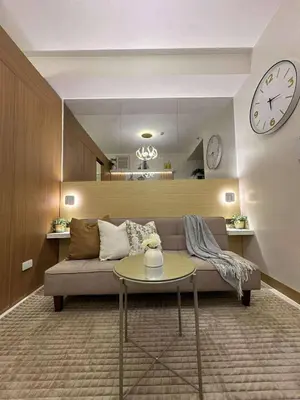 a living room with a couch and a table at RED LUXE HAVEN Comfy stay, Netflix and Fast WiFi Ready in Manila
