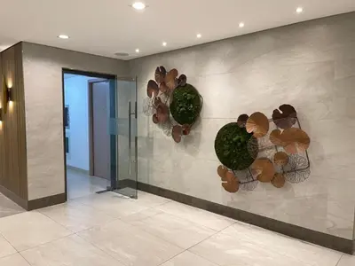 a lobby with a wall with flowers on it at Green 2 Residences Tower1 unit 512 in Dasmariñas