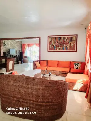 a living room with a couch and a table at Majesty Suites in Manila