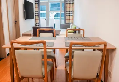 a dining room with a table and chairs at Grand Marina Residences in Manila