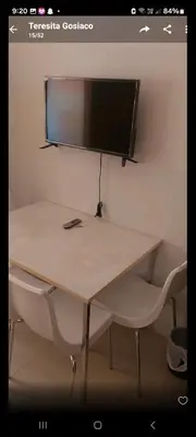 a desk with a computer monitor on top of it at Sea Residences By Queen in Manila