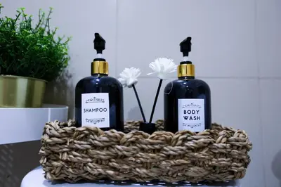 two bottles of soap in a basket on a table at Apartment near MOA & Airport in Manila