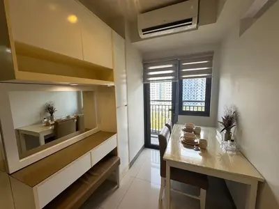 a kitchen with a table and a dining room at S Residences Room 910B near MOA, IKEA & NAIA by Prime Stay in Manila