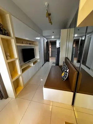 a living room with a couch and a flat screen tv at S Residences Room 910B near MOA, IKEA & NAIA by Prime Stay in Manila