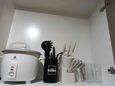 a kitchen counter with a food processor and utensils at S Residences Room 910B near MOA, IKEA & NAIA by Prime Stay in Manila