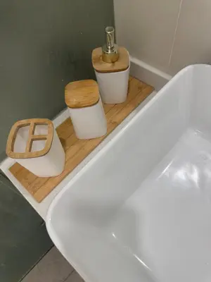 a bathroom with a bath tub with two toilets at La Casa Zen - Cozy Studio with private Wi-Fi, complimentary access to Fitness Centre, swimming pool and stunning city view located near the CBD of Ortigas, Makati, BGC in Manila