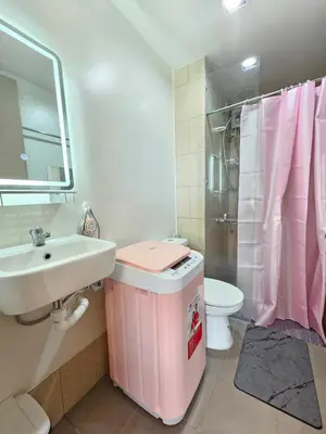 a bathroom with a sink and a toilet and a shower at RM South Staycation in Biñan