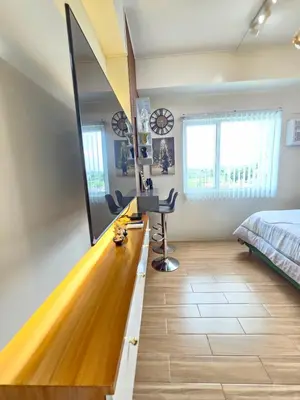 a room with a bowling alley in a bedroom at RM South Staycation in Biñan