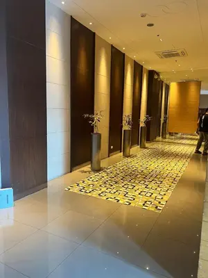 a hallway of a hotel with a lobby with a lobby at 2BR Condo - Makati CBD, Sunset Views, 20mins to NAIA in Manila