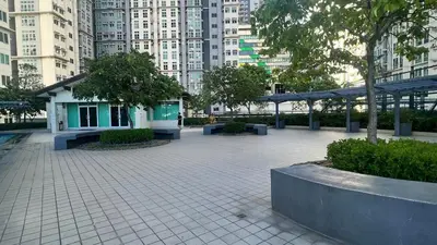 a park with benches and trees in a city at 2BR Condo - Makati CBD, Sunset Views, 20mins to NAIA in Manila