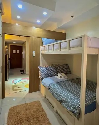 a bedroom with two bunk beds in a room at MOA Shell Residences Staycation in Manila