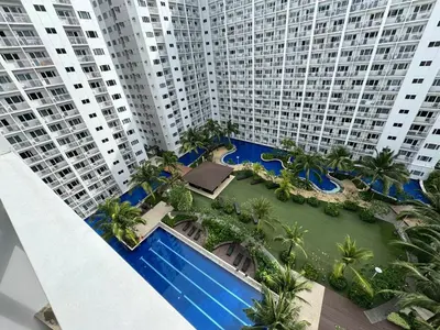 an aerial view of a large apartment complex with palm trees at Shore Residences Banana Room with 2 Beds Good for 4 Guests Pool View Room 622 by Prime Stay in Manila