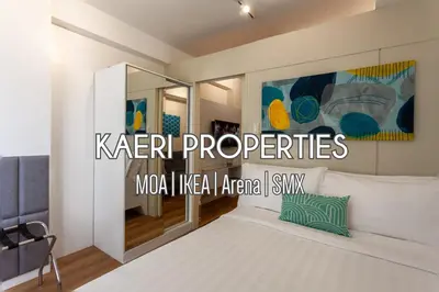 a bedroom with a bed and a sign that reads karr properties at Sparkling Shell Residences Kaeri Properties in Manila
