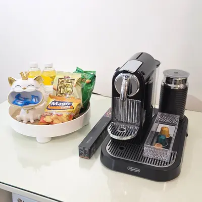 a blender sitting on a counter next to a bowl of food at Sparkling Shell Residences Kaeri Properties in Manila
