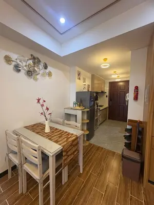 a kitchen and dining room with a table and chairs at Sybay suites beside okada manila near AirPort MOA COD MSV1807H in Manila