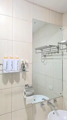 a bathroom with a sink and a mirror at Birch Tower Big Studio Type Unit 2711 in Manila