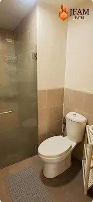 a bathroom with a toilet and a shower at JFam Suites, C3-9D Studio, Up To 4 Pax in Biñan