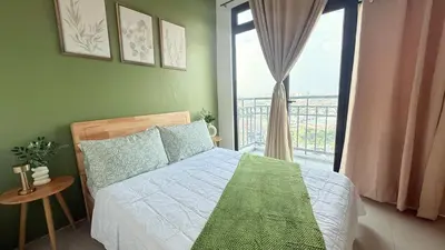 a bedroom with a bed and a large window at Harbour Park Residences Cozy 1BR Suite in Manila