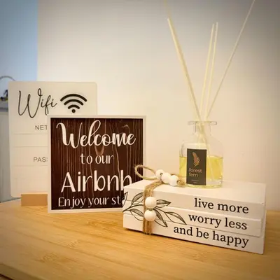 a welcome to our antioch sign and a bottle on a table at Harbour Park Residences Cozy 1BR Suite in Manila