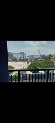a view of a beach from a window at Sea Residences Crisha in Manila