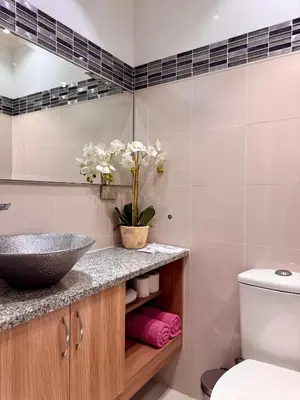 a bathroom with a sink and a toilet at Charming Unit at Smdc Sun Residences in Manila