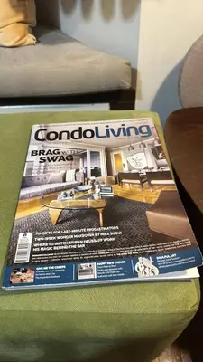 a magazine sitting on top of a table at Luxurious Studio in McKinley Hill with City View in Manila