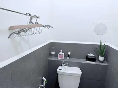 a bathroom with a toilet and a sink at Cozy Place to Stay in Manila