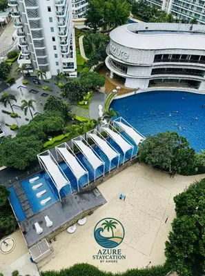 an aerial view of a building with a swimming pool at Affordable Boracay-like Staycation in Azure South in Manila