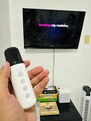 a person holding a wii remote in their hand at Affordable Boracay-like Staycation in Azure South in Manila