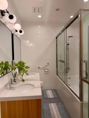 a bathroom with a sink and a shower at Elegant 4BR penthouse in BGC in Manila