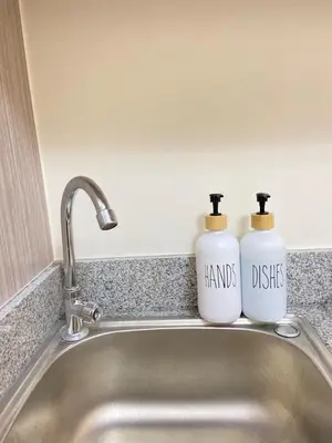 two bottles of detergent sitting on top of a sink at Walk to Araneta, MRT and Malls, Cubao, Netflix in Manila