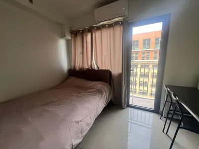 a small bedroom with a bed and a window at Shore 2 Tower 3 SmDC Residences Condo near Mall of Asia Pasay city, Philippines in Manila