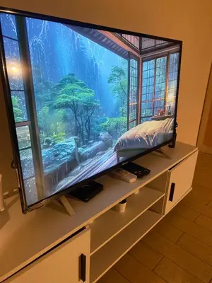 a large flat screen tv with a large aquarium at 3ms and jacob havens in Manila