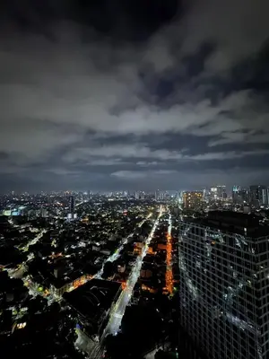 a view of a city at night at Stunning 42nd Floor Apt with Netflix in Manila