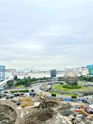 a construction site with a large building in the background at Yoona era Staycation in Manila
