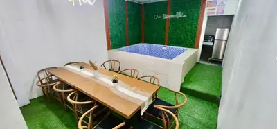 a room with a table and a bath tub at Cozy Villa with Dipping Pool in Bacoor
