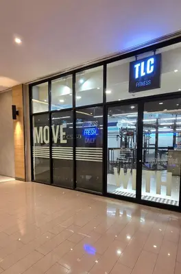 a shopping mall with a move sign on the doors at Explore Mitsukoshi BGC with pool and wifi in Manila