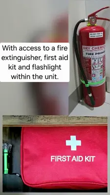 a red first aid kit on a shelf next to a fire extinguisher at Explore Mitsukoshi BGC with pool and wifi in Manila