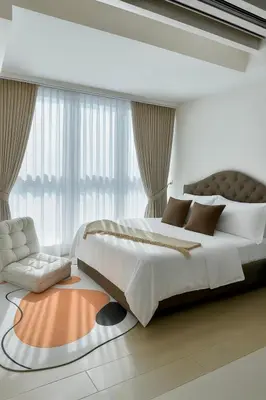 a bedroom with a large bed and a large window at Cozy 1-Bedroom in Uptown Parksuites BGC in Manila