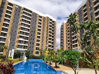 a view of apartment buildings with a swimming pool at 1 BR Taytay HIVE Condo WIFI Netflix Pool Patio in Taytay