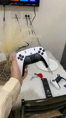 a person is holding a video game controller at HJ Haven in Manila