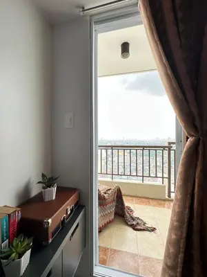 a room with a sliding glass door with a balcony at Resort-style oasis at the the heart of the city in Manila