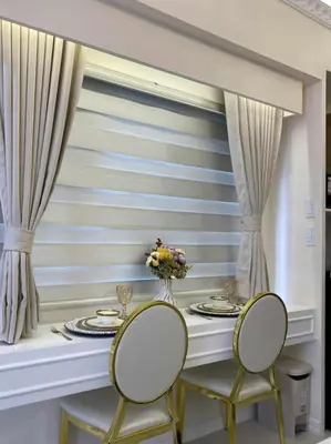 a dining room with a table and two chairs at Chateau Lumiere Staycation at MOA in Manila