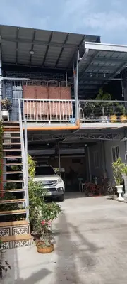 a car parked in front of a house with a balcony at 6 Guest - Unit 6 Studio type - Container house in Pasong Mannga