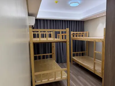 two bunk beds in a room with a ceiling at Condotel by Heidi in Manila