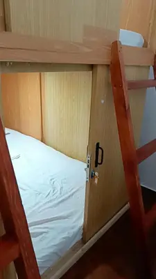 an open door to a bunk bed in a room at Capsule88 Hotel in Manila