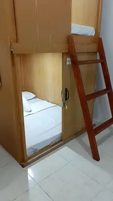 a couple of bunk beds in a room at Capsule88 Hotel in Manila