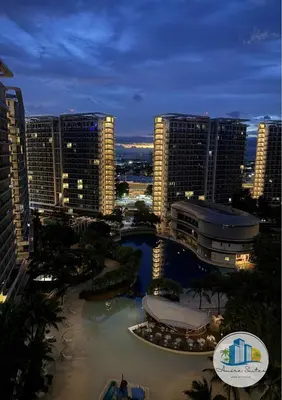 a view of a city at night with tall buildings at Azure residences by Amóre Suites in Manila