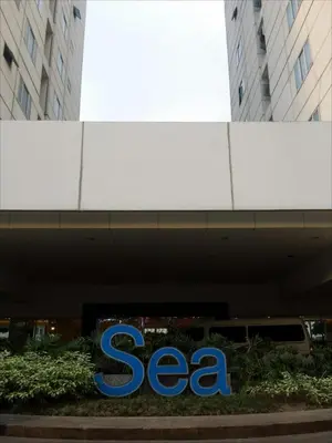 a sign for a seagate company in front of a building at My Cozy Little Crib - Sea Residence - Tower C in Manila